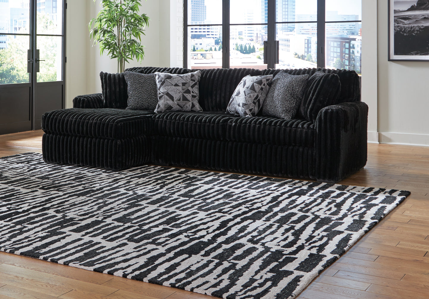 Bradenton Furniture Outlet - Ashley Furniture - Midnight-Madness Sectional - RAF 2-Piece Sectional Sofa with Chaise / Onyx - 98103S1