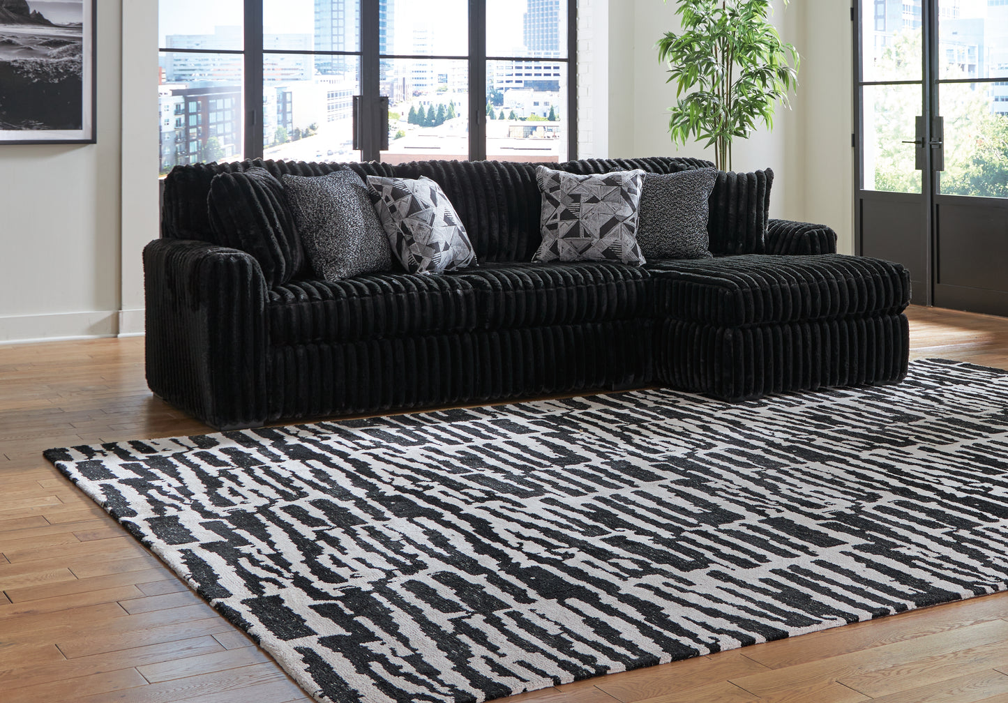 Bradenton Furniture Outlet - Ashley Furniture - Midnight-Madness Sectional - LAF 2-Piece Sectional Sofa with Chaise / Onyx - 98103S2
