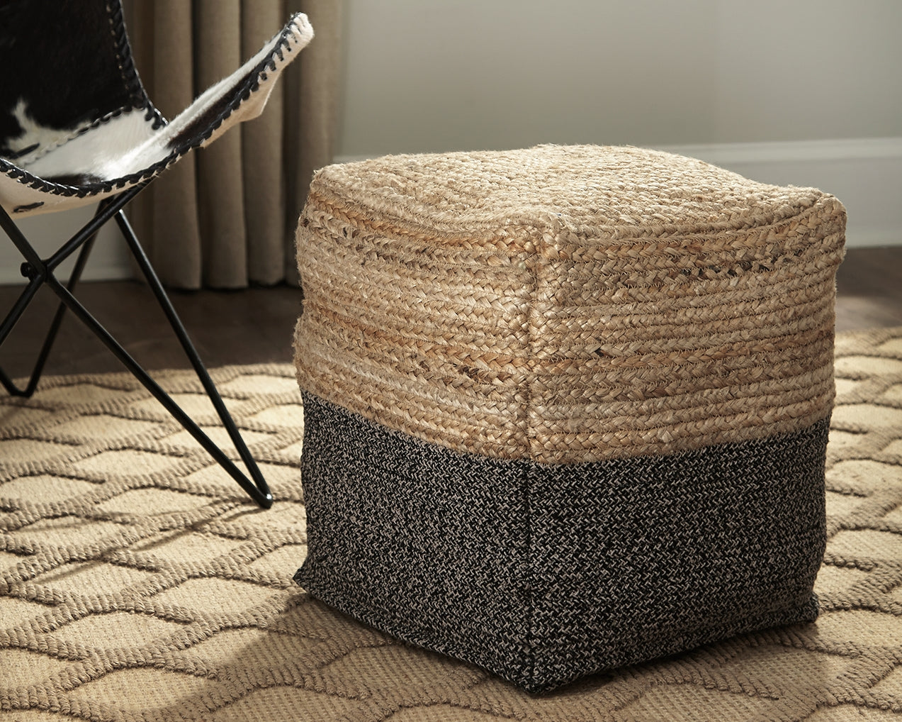 Bradenton Furniture Outlet - Ashley Furniture - Sweed Valley Pouf - Pouf / Natural/Black - A1000422
