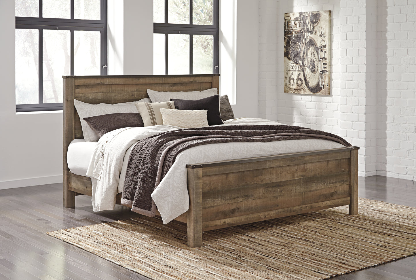 Bradenton Furniture Outlet - Ashley Furniture - Trinell Bedroom - King Panel Bed / Brown - B446B23