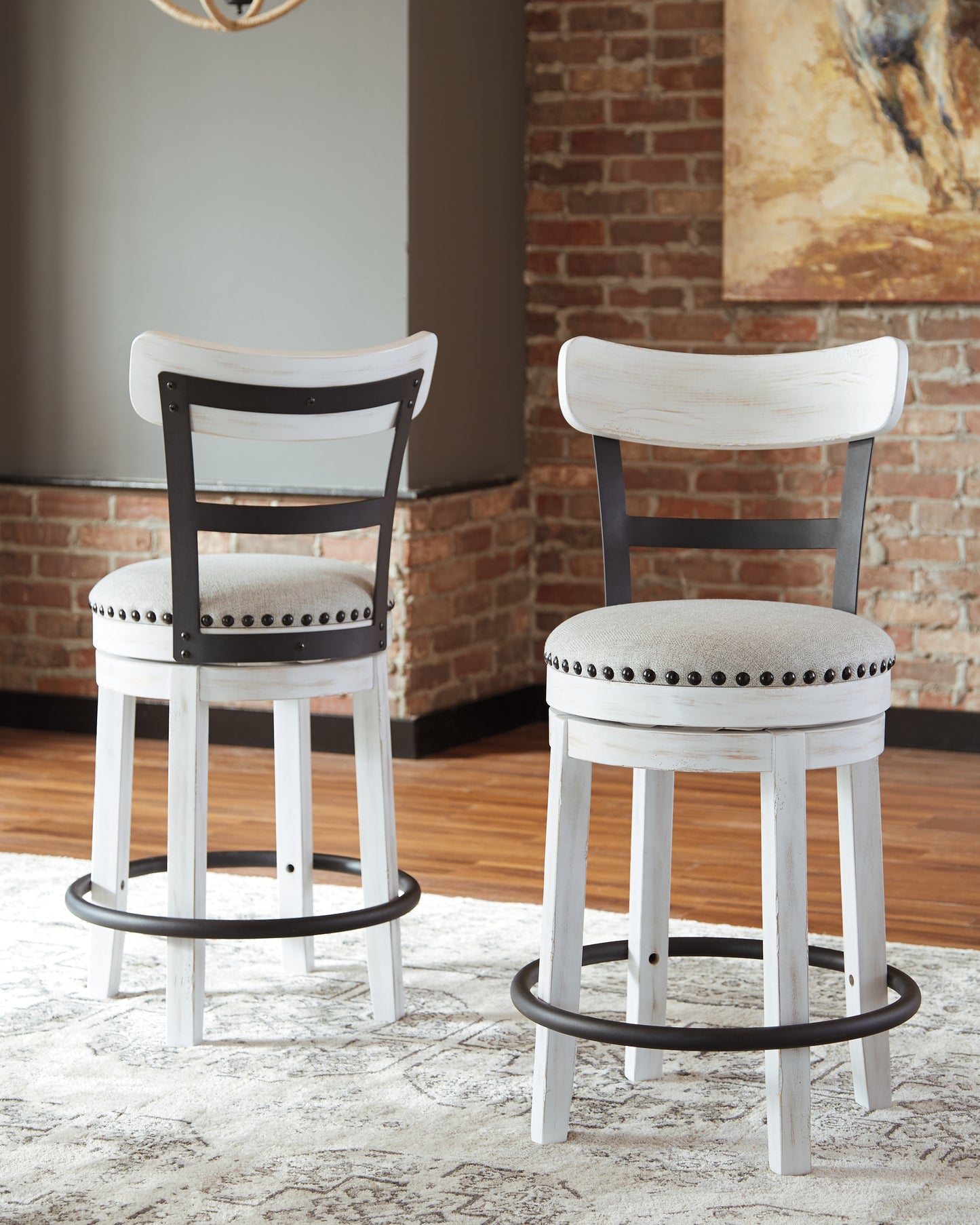 Bradenton Furniture Outlet - Ashley Furniture - Valebeck Dining Room - UPH Swivel Barstool (1/CN) / White - D546-524