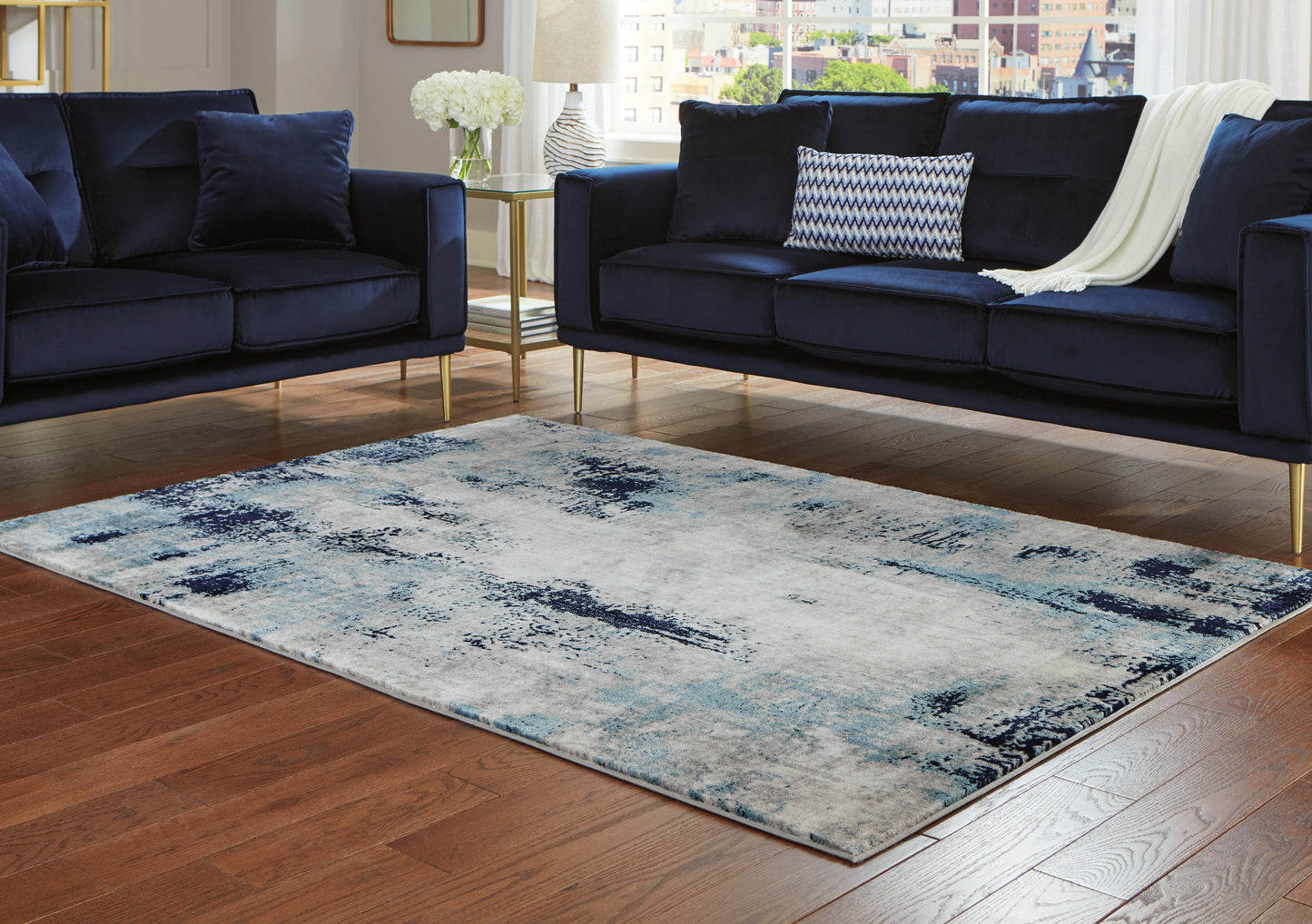 Bradenton Furniture Outlet - Ashley Furniture - Leonelle Rug - 7'10" x 10' Rug / White/Blue/Gray - R404871