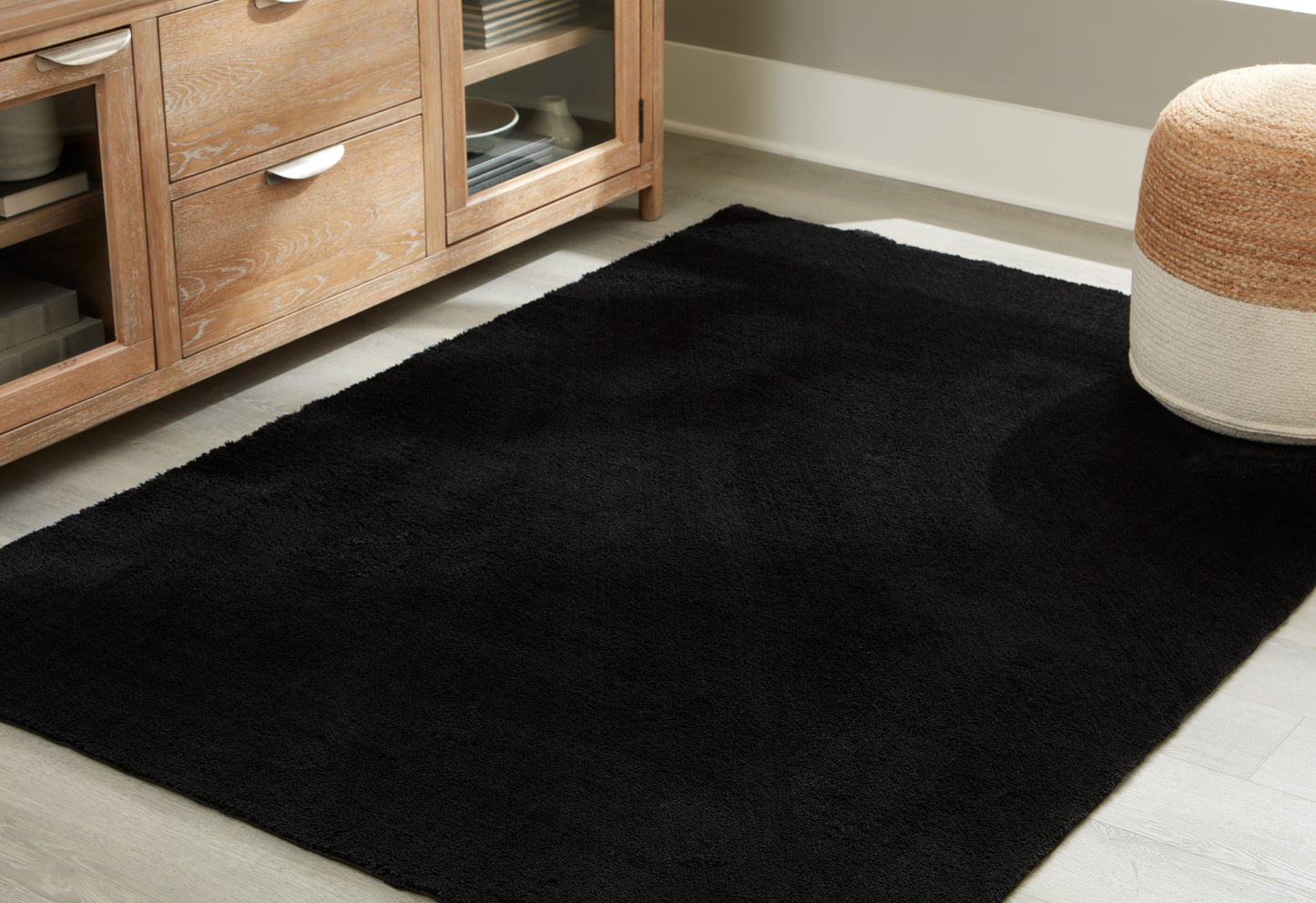Bradenton Furniture Outlet - Ashley Furniture - Anaben Rug - 5' x 7' Washable Rug / Black - R406312