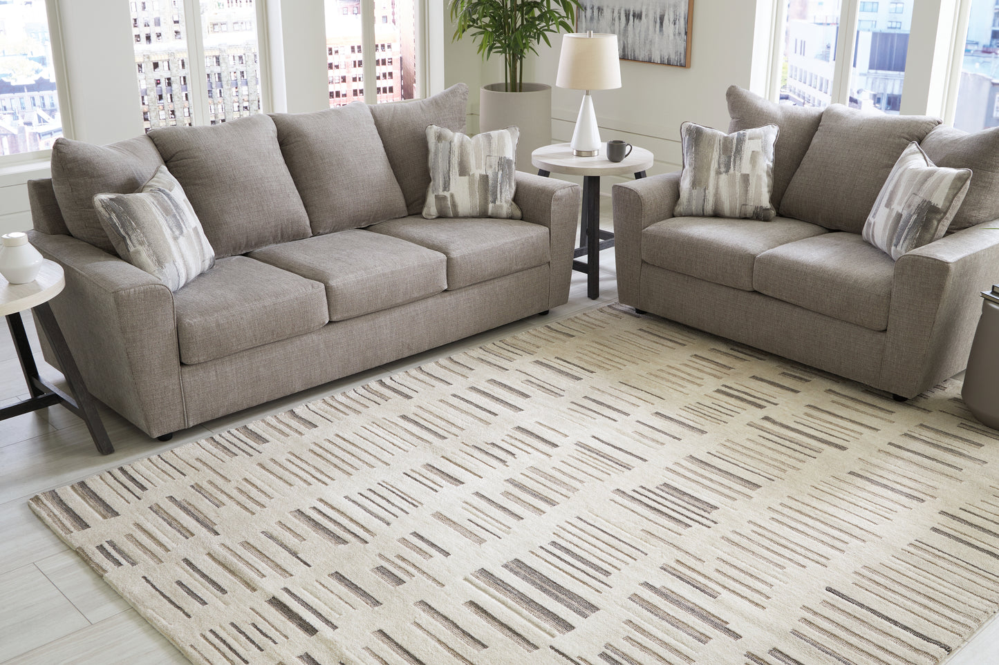 Bradenton Furniture Outlet - Ashley Furniture - Leesdale Rug - 8' x 10' Rug / Ivory/Brown/Black - R406421