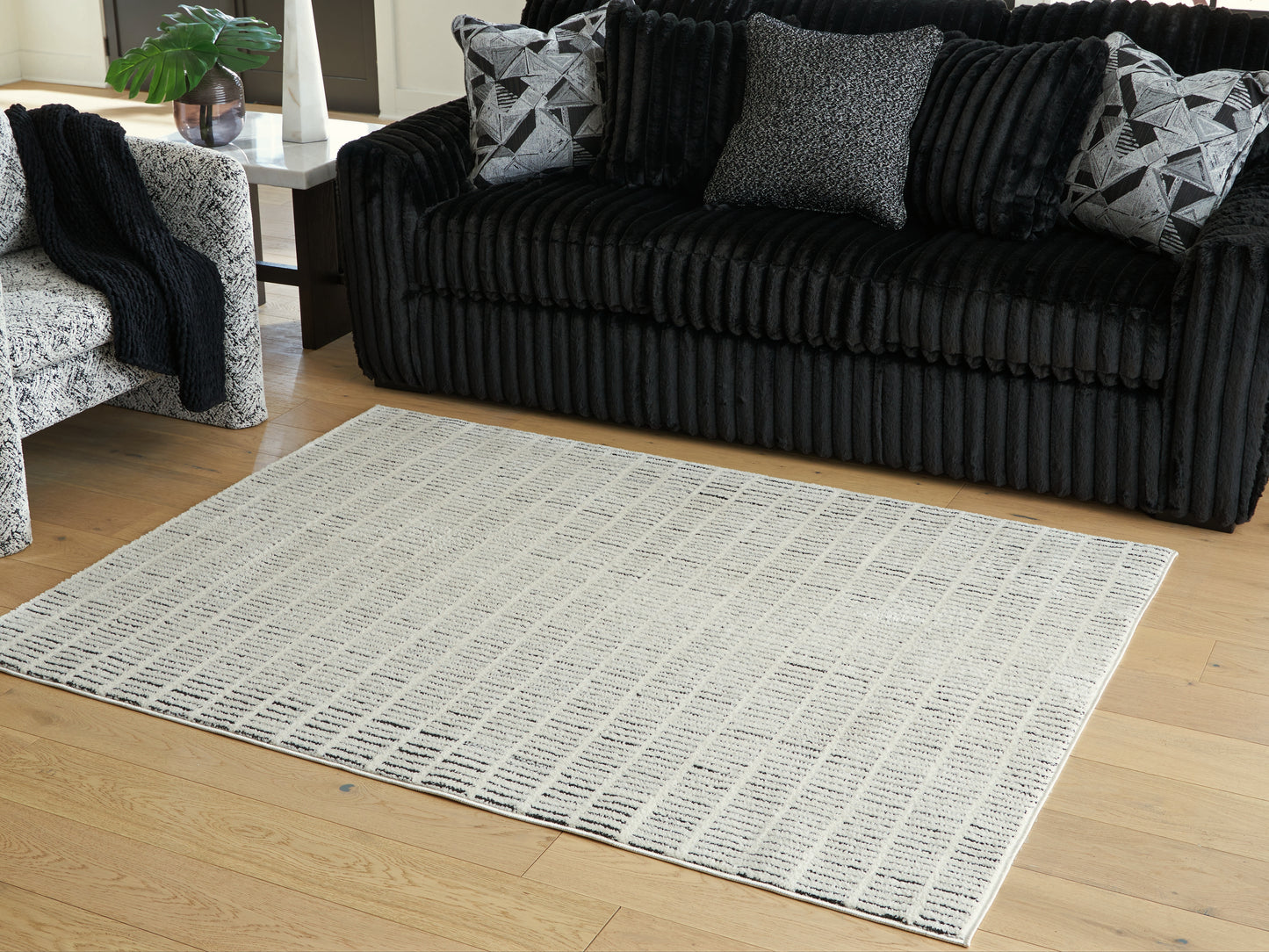 Bradenton Furniture Outlet - Ashley Furniture - Turinwith Rug - 5'3" x 7' Area Rug / Ivory/Black - R407552