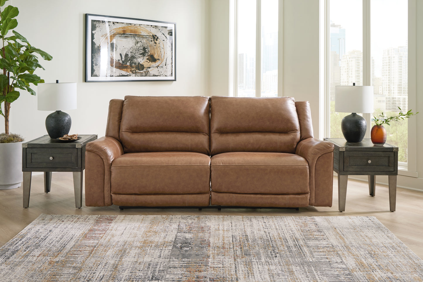 Bradenton Furniture Outlet - Ashley Furniture - Trasimeno Living Room - 2 Seat PWR REC Sofa ADJ HDREST / Caramel - U8281547