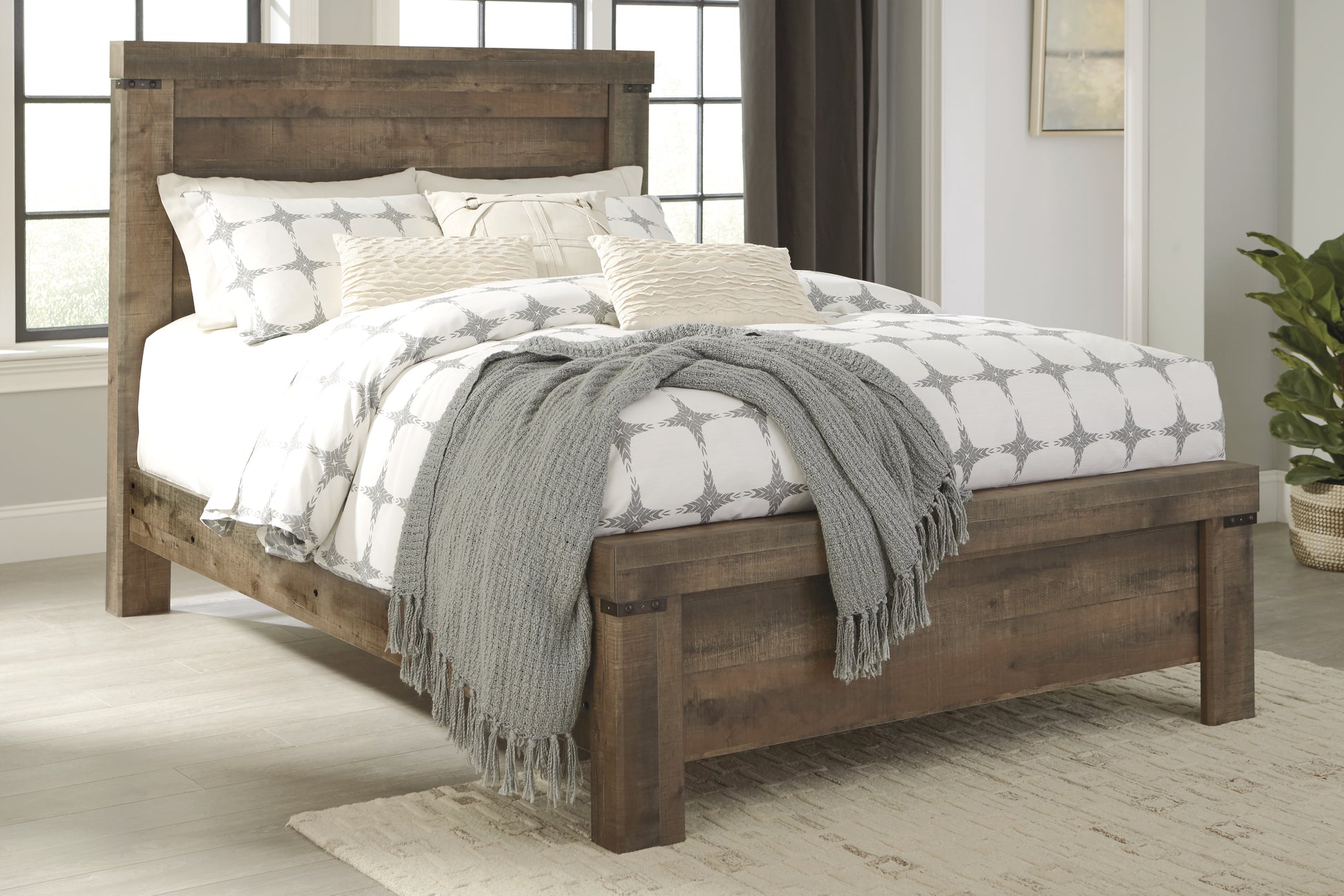 Bradenton Furniture Outlet - Ashley Furniture - Trinell Bedroom - Queen Panel Bed / Brown - B446B48