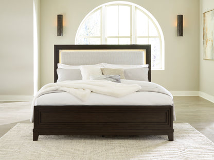 Bradenton Furniture Outlet - Ashley Furniture - Neymorton Bedroom - King Upholstered Panel Bed / Dark Grayish Brown - B618B4