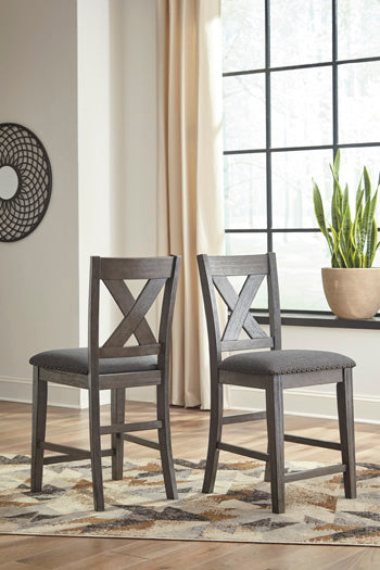 Bradenton Furniture Outlet - Ashley Furniture - Caitbrook Dining Room - Counter Height Upholstered Bar Stool (Set of 2) / Gray - D388-124X2