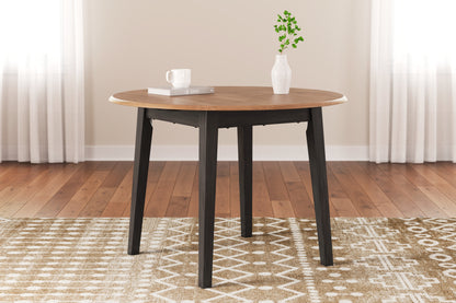 Bradenton Furniture Outlet - Ashley Furniture - Gesthaven Dining Room - Round DRM Drop Leaf Table / Natural/Brown - D396-15
