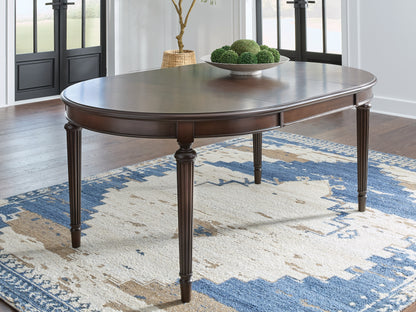 Bradenton Furniture Outlet - Ashley Furniture - Lavinton Dining Room - Oval Dining Room EXT Table / Brown - D764-35