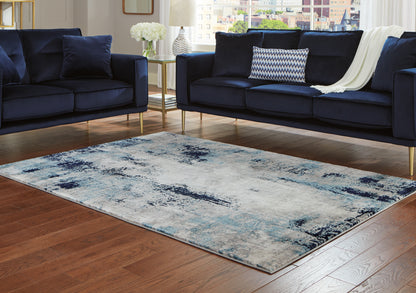 Bradenton Furniture Outlet - Ashley Furniture - Leonelle Rug - 7'10" x 10' Rug / White/Blue/Gray - R404871