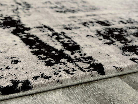 Bradenton Furniture Outlet - Ashley Furniture - Zekeman Rug - 7'10" x 10' Rug / Black/Cream/Gray - R404921
