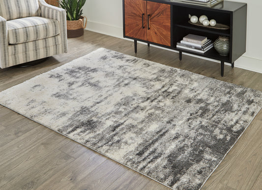 Bradenton Furniture Outlet - Ashley Furniture - Gerdie Rug - 7'10" x 10' Rug / Cream/Gray - R404991