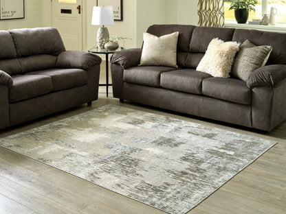 Bradenton Furniture Outlet - Ashley Furniture - Arriston Rug - 7'10" x 10' Washable Rug / Multi - R405561