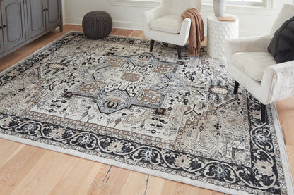 Bradenton Furniture Outlet - Ashley Furniture - Gregmoore Rug - 7'9" x 9'11" Washable Rug / Multi - R405821