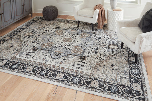 Bradenton Furniture Outlet - Ashley Furniture - Gregmoore Rug - 7'9" x 9'11" Washable Rug / Multi - R405821