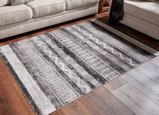 Bradenton Furniture Outlet - Ashley Furniture - Henchester Rug - 8' x 10' Washable Rug / Multi - R405991