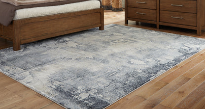 Bradenton Furniture Outlet - Ashley Furniture - Langrich Rug - 7'10" x 10'6" Rug / Blue/Gray/Cream - R406131
