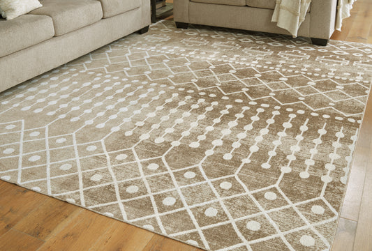 Bradenton Furniture Outlet - Ashley Furniture - Bunchly Rug - 7'10" x 10'3" Washable Rug / Tan/Brown/Cream - R406221