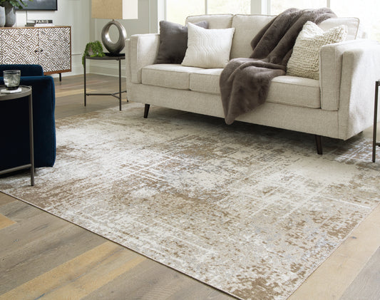 Bradenton Furniture Outlet - Ashley Furniture - Grifflain Rug - 7'10" x 10'3" Washable Rug / Tan/Brown/Gray - R406231