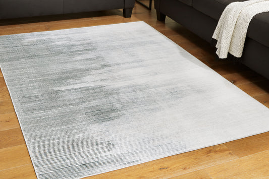 Bradenton Furniture Outlet - Ashley Furniture - Milset Rug - 5'1" x 6'10" Washable Rug / Black/White/Gray - R406252