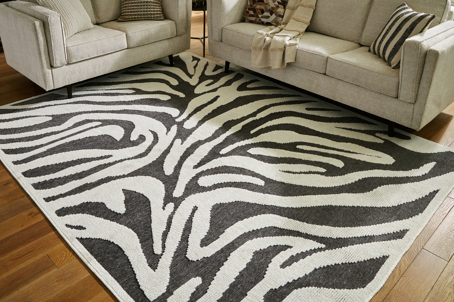 Bradenton Furniture Outlet - Ashley Furniture - Thomwith Rug - 8' x 10'2" Washable Rug / Black/Ivory - R406291