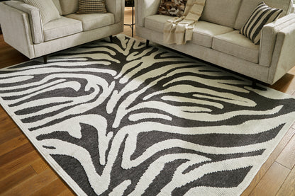 Bradenton Furniture Outlet - Ashley Furniture - Thomwith Rug - 8' x 10'2" Washable Rug / Black/Ivory - R406291