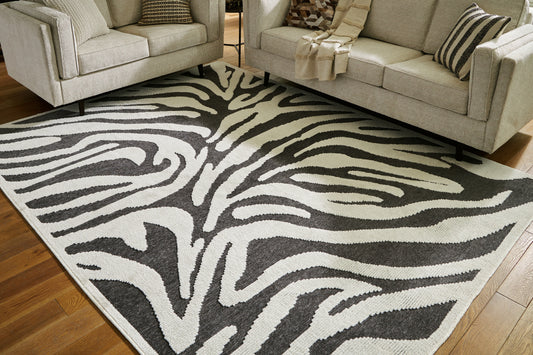 Bradenton Furniture Outlet - Ashley Furniture - Thomwith Rug - 8' x 10'2" Washable Rug / Black/Ivory - R406291
