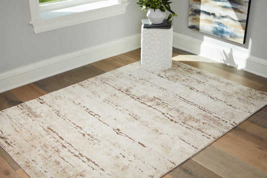 Bradenton Furniture Outlet - Ashley Furniture - Kasney Rug - 5' x 7' Rug / Cream/Brown - R406852