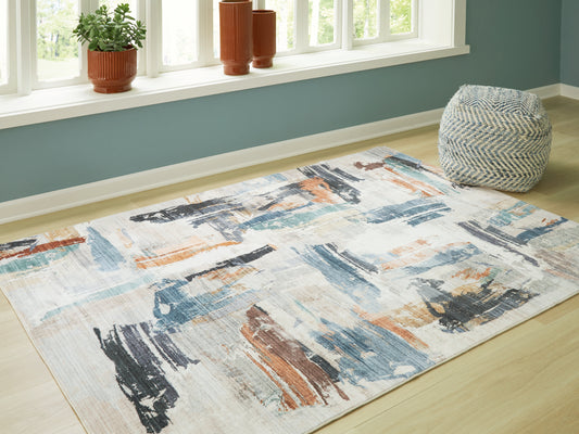 Bradenton Furniture Outlet - Ashley Furniture - Hessland Rug - 8' x 10' Washable Rug / Multi - R407051