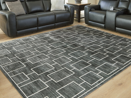 Bradenton Furniture Outlet - Ashley Furniture - Elderland Rug - Washable 7'6" x 9'6" Area Rug / Black/Gray - R407401