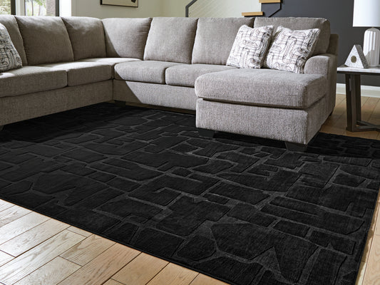 Bradenton Furniture Outlet - Ashley Furniture - Gibbswell Rug - Washable 5' x 7' Area Rug / Black - R407462