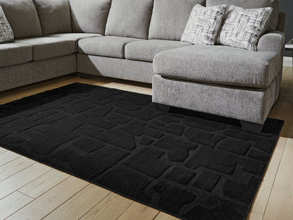 Bradenton Furniture Outlet - Ashley Furniture - Gibbswell Rug - Washable 5' x 7' Area Rug / Black - R407462