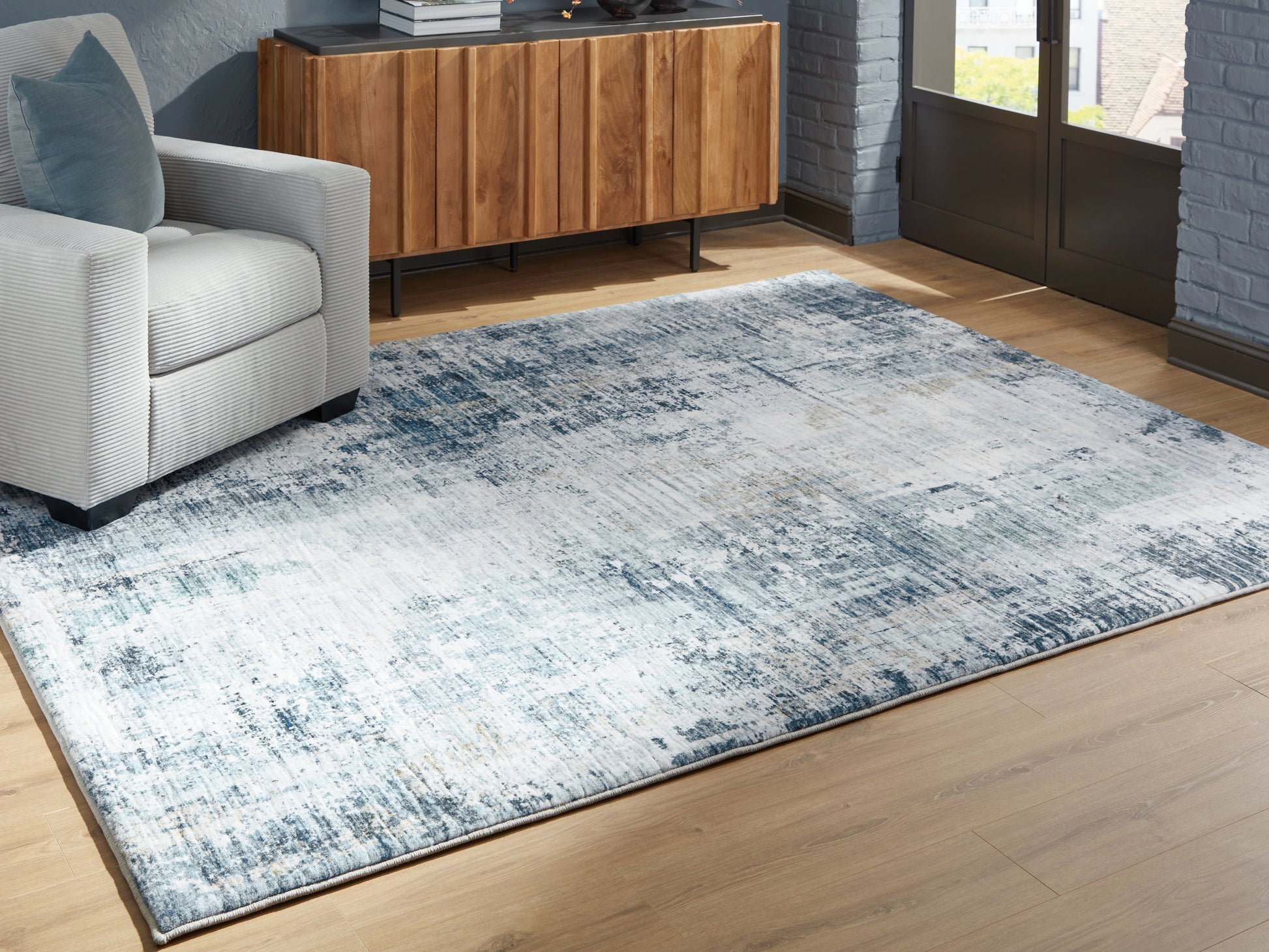 Bradenton Furniture Outlet - Ashley Furniture - Arlenmont Rug - 5' x 7' Area Rug / Blue/White/Brown - R407482