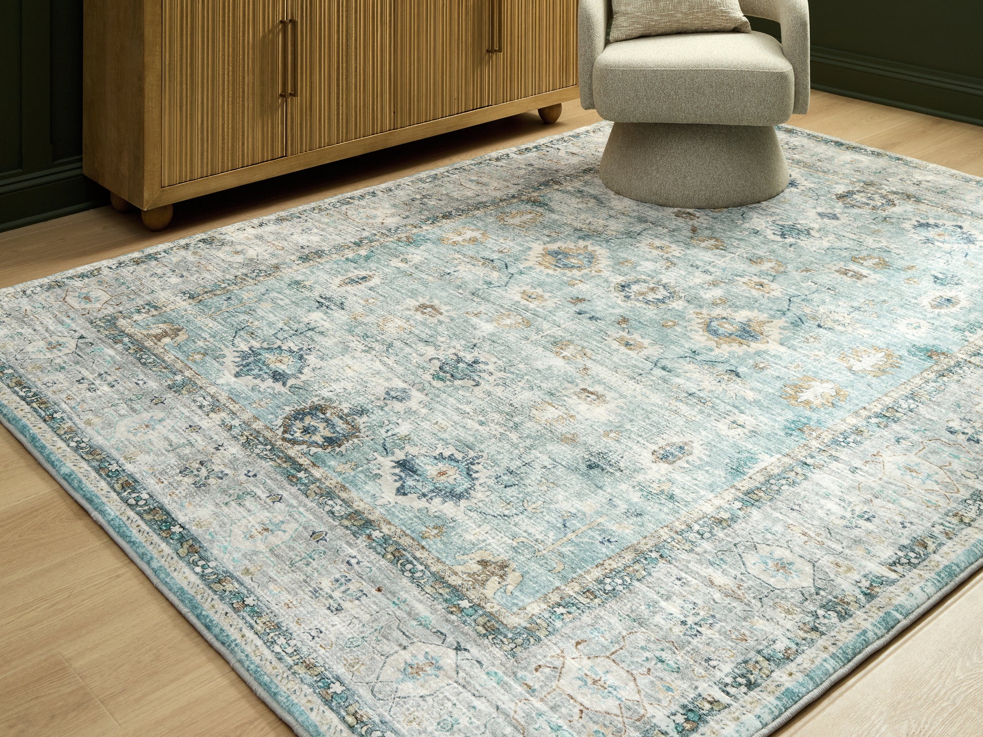 Bradenton Furniture Outlet - Ashley Furniture - Ladstoney Rug - 7'6" x 9'6" Area Rug / Teal/Beige/Ochre - R407501