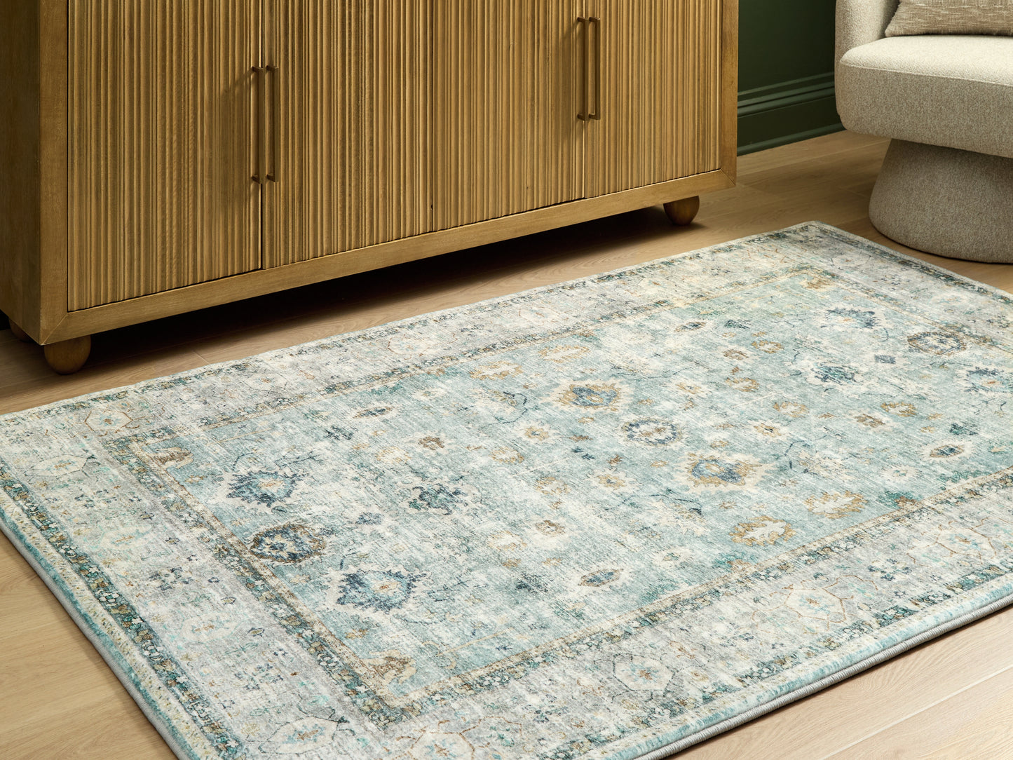 Bradenton Furniture Outlet - Ashley Furniture - Ladstoney Rug - 5' x 7' Area Rug / Teal/Beige/Ochre - R407502