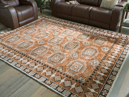 Bradenton Furniture Outlet - Ashley Furniture - Qaabiz Rug - 5' x 7' Area Rug / Sienna/Ivory/Black - R407522
