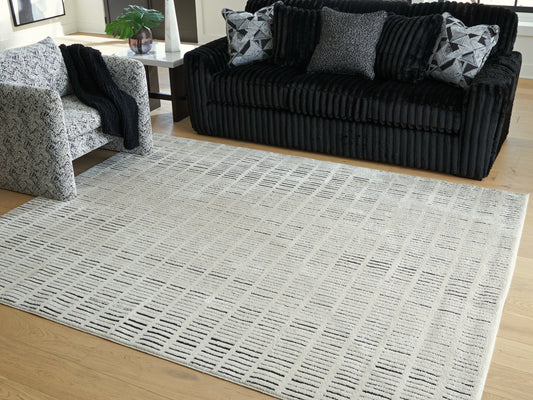 Bradenton Furniture Outlet - Ashley Furniture - Turinwith Rug - 5'3" x 7' Area Rug / Ivory/Black - R407552