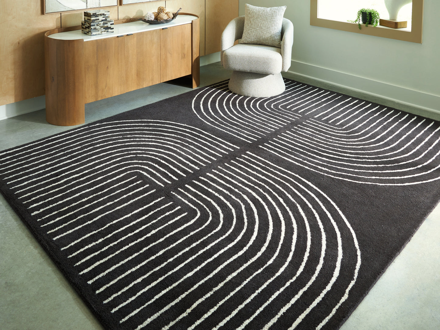 Bradenton Furniture Outlet - Ashley Furniture - Eldonmore Rug - 7'8" x 10' Area Rug / Black/Ivory - R407571