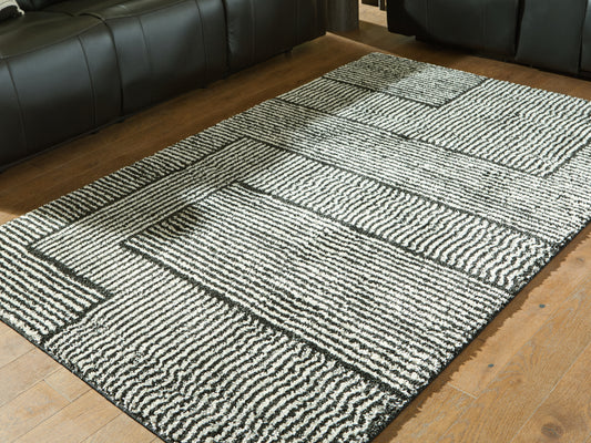 Bradenton Furniture Outlet - Ashley Furniture - Kurtmen Rug - 5' x 7' Area Rug / Black/Ivory - R407592