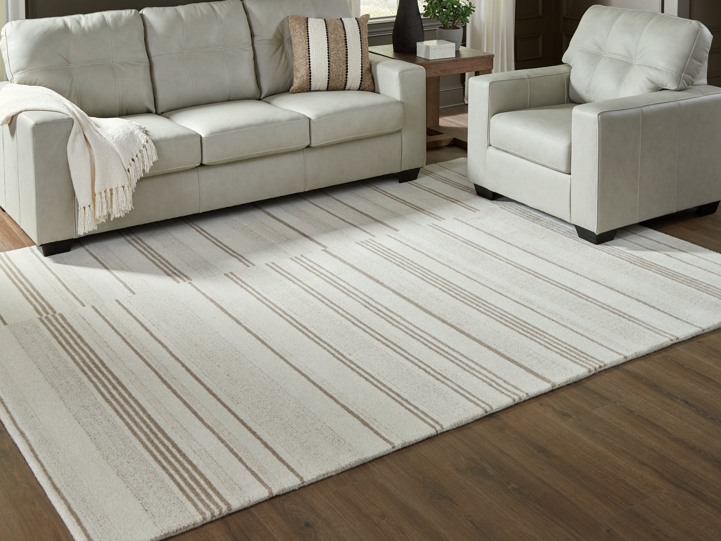 Bradenton Furniture Outlet - Ashley Furniture - Gadence Rug - 7'8" x 10' Area Rug / Ivory/Tan - R407641