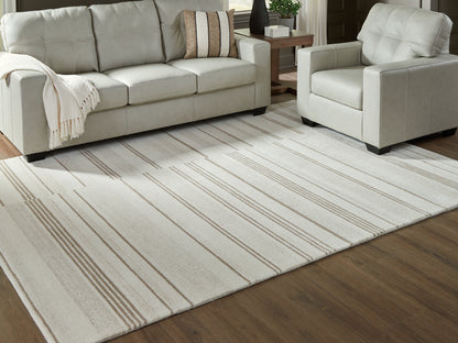 Bradenton Furniture Outlet - Ashley Furniture - Gadence Rug - 7'8" x 10' Area Rug / Ivory/Tan - R407641