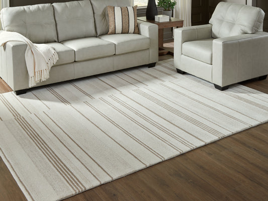 Bradenton Furniture Outlet - Ashley Furniture - Gadence Rug - 7'8" x 10' Area Rug / Ivory/Tan - R407641