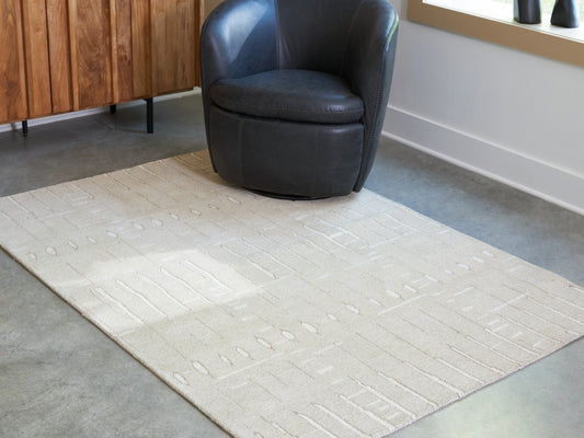 Bradenton Furniture Outlet - Ashley Furniture - Wolbert Rug - 7'8" x 10' Area Rug / Tan/Ivory - R407661