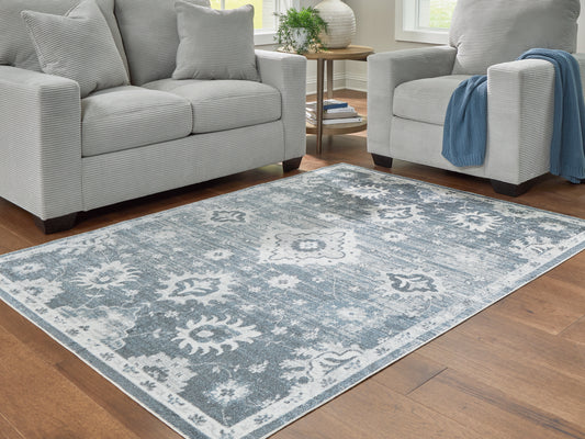 Bradenton Furniture Outlet - Ashley Furniture - Avanworths Rug - Washable 7'10" x 10' Area Rug / Blue/Gray/Ivory - R407791