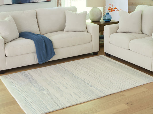 Bradenton Furniture Outlet - Ashley Furniture - Genemost Rug - 7'8" x 10' Area Rug / Ivory/Blue - R407841