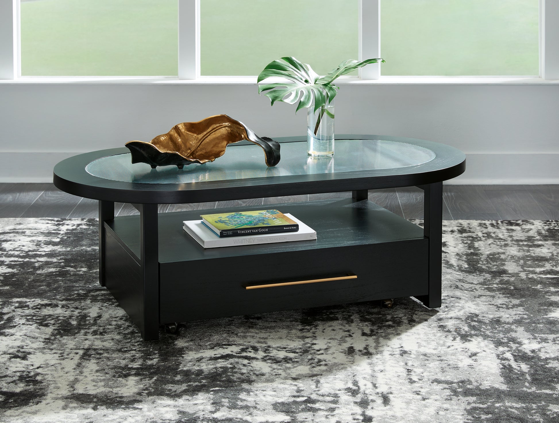 Bradenton Furniture Outlet - Ashley Furniture - Winbardi Coffee Table - Oval Cocktail Table / Black - T786-0