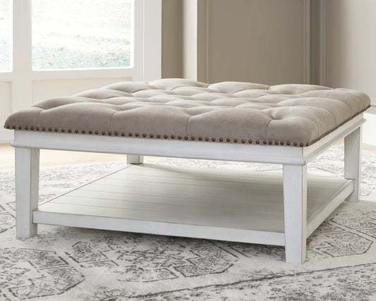 Bradenton Furniture Outlet - Ashley Furniture - Kanwyn Upholstered Ottoman Coffee Table - UPH Ottoman Cocktail Table / Whitewash - T937-21