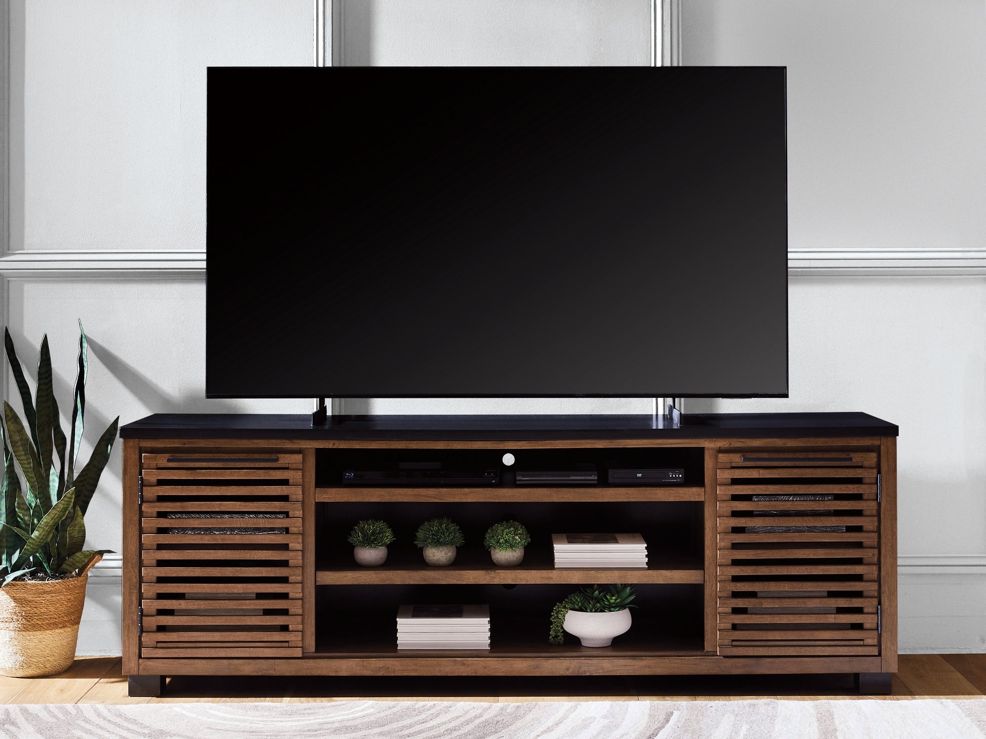 Bradenton Furniture Outlet - Ashley Furniture - Kallari 84" TV Stand - 84" / Warm Brown/Black - W737-78